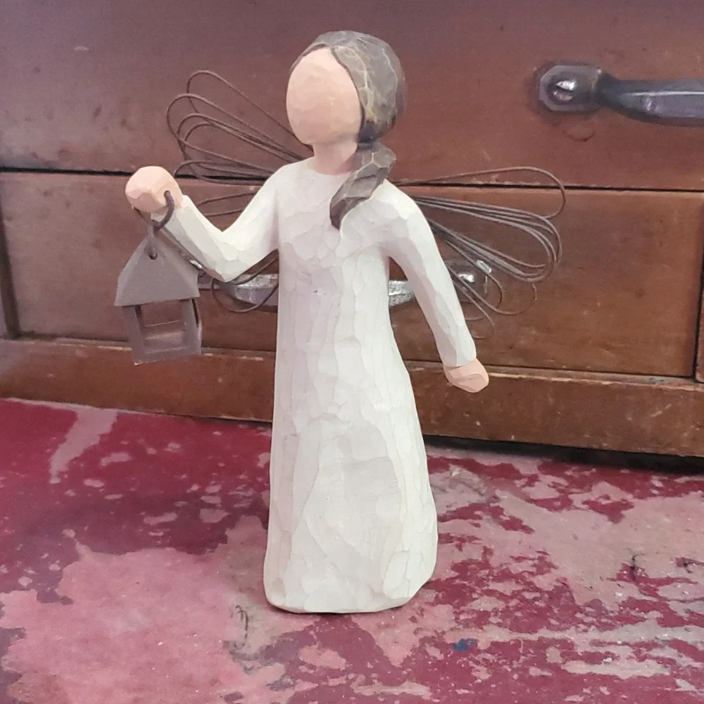 Willow Tree - Angel of Hope. Girl holding lantern.